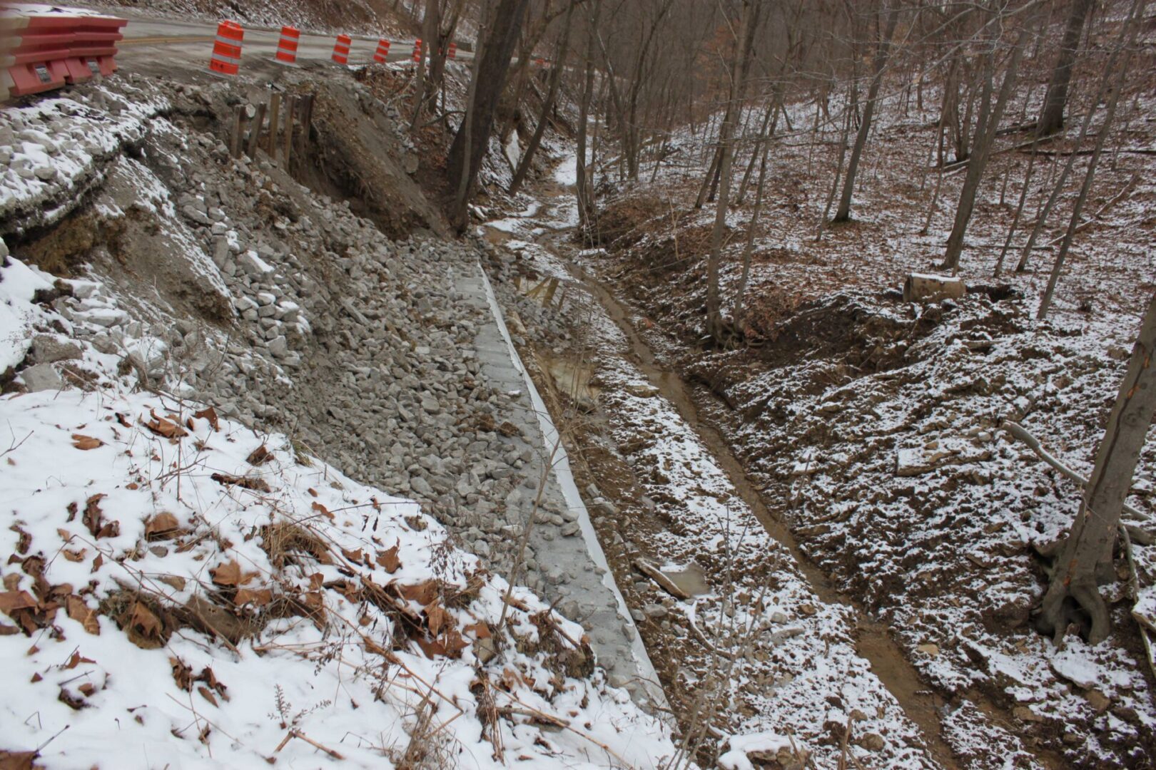 A snow covered hillside with a steep slope.